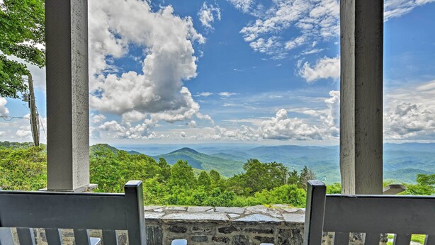 A stone bench with a view of a mountainous landscape and a clear sky. - Amazing Historic Home w/ Stunning Mountain Views! (Blowing Rock)