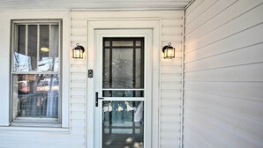 A white house with a front door, two windows, and two wall-mounted lanterns. - Historic Staunton Home ~ 1 Mi to Downtown! (Staunton)