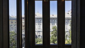 A view through a window with a building in the background. - Garibaldi Attic by Wonderful Italy (Genoa)