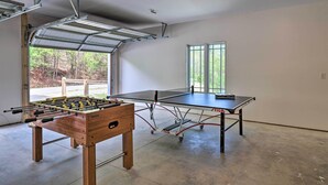 A spacious room with a ping pong table and a foosball table. - Mountain Refuge w/ View, 12 Mi to Asheville! (Candler)