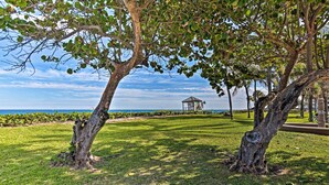 A park with a gazebo, grassy areas, and trees. - 1 Block to Deerfield Beach: Studio w/ Fire Pit! (Deerfield Beach)