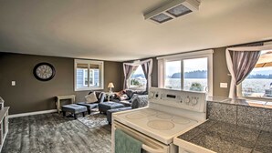 A compact kitchen with a stove and a dining area.