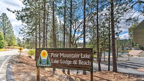 A sign for Pine Mountain Lake Lodge & Beach. - Deck & Hot Tub: Rustic Groveland Home! (Groveland)