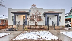 A modern two-story house with a central tree, a driveway, and a garage. - Modernized SLC Duplex w/ Yard ~ 4 Mi to Dtwn! (Salt Lake City)