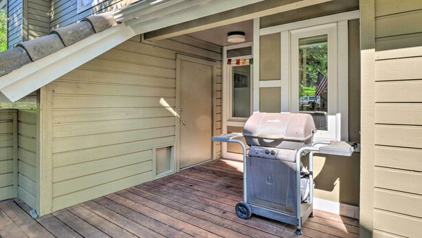 A covered porch with a grill and a sliding door. - Peaceful Edwards Condo w/ Mountain Views! (Edwards)