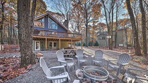 A lodge with a deck, outdoor seating, and a fire pit. - Game Room, Fire Pit & Deck: Spacious Poconos Home! (Lake Harmony)