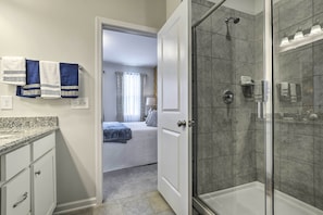 A bathroom with a shower, a toilet, and a sink. - Sleek Durham Townhome Near Dtwn w/ Balcony! (Durham)