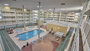 A multi-level indoor swimming pool with multiple decks and lounge areas. - Long-term Stays Welcome: HH Island Resort Condo (Hilton Head Island)