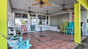 A café with two ceiling fans, a tiled floor, and a window with a sign reading "COFFEE ESPRESSO". - Tropical Pass-a-grille Gem w/ Direct Beach Access! (St. Pete Beach)