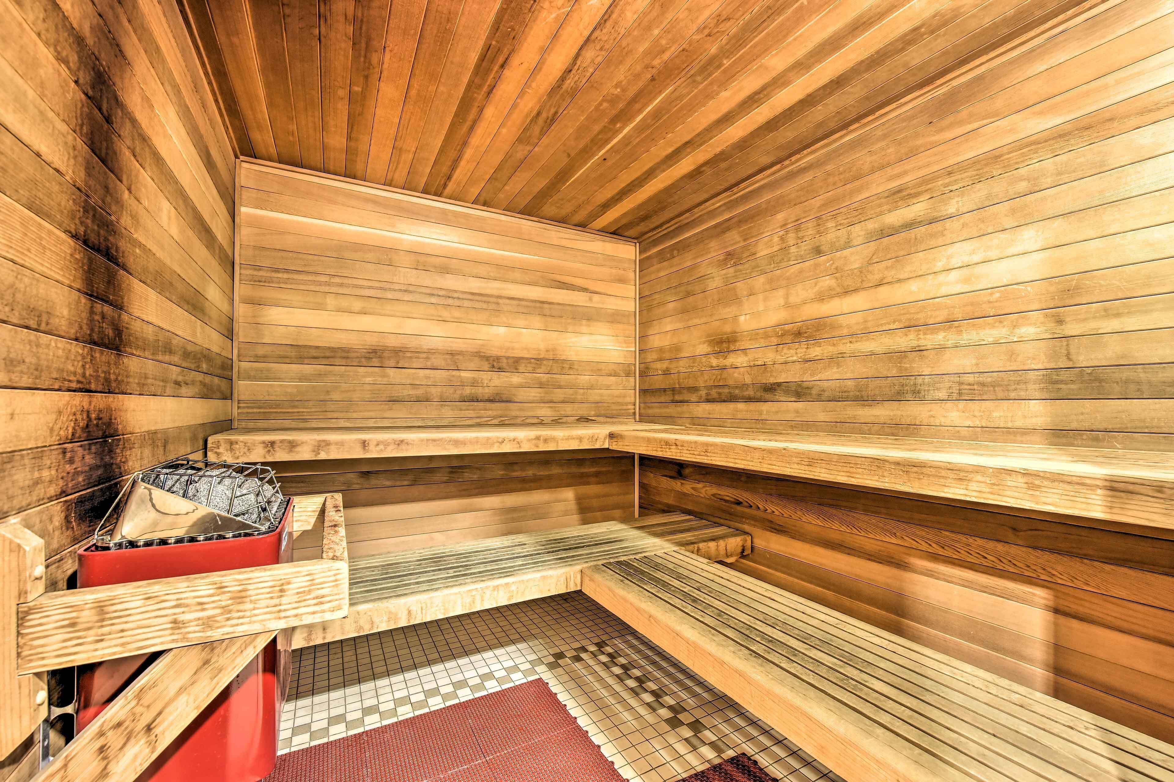 A sauna with wooden walls and benches.