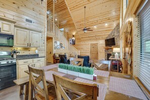 A wooden cabin interior with a kitchen, dining area, and living room. - 'penny Lane Lodge' Broken Bow Cabin < 6 Mi to Lake (Broken Bow)