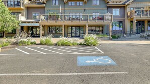 A multi-story building with a parking lot marked for disabled parking. - Half-mi to Payette Lake: Dtwn Mccall Condo! (McCall)