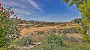 A rural landscape with a clear sky, rolling hills, and a distant view of a town. - Spacious & Private Wine Country Villa w/ View (Temecula)