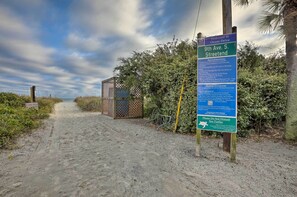 A beach path with a sign indicating 'Welcome to Ocean Drive' and '9th Ave. S. Streetend' along with beach regulations and a turtle protection notice. - Steps to Ocean: Breezy Myrtle Beach Bungalow! (North Myrtle Beach)