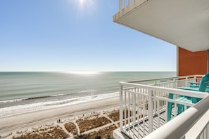 A balcony with a view of the beach and ocean. - Myrtle Beachfront Bliss: Pools, Views & Skywheel! (Myrtle Beach)