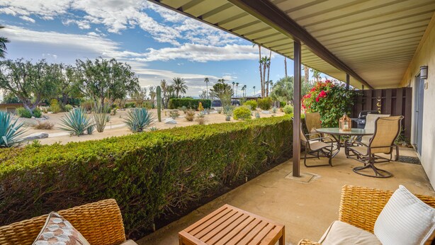 A covered patio area with wicker furniture, a table, and chairs. - Borrego Springs Vacation Rental: Patio & Gas Grill (Borrego Springs)