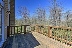 A wooden deck with a railing, surrounded by trees. - 6 Mi to Kalahari: Pocono Pines Golf Course Home! (Pocono Pines)