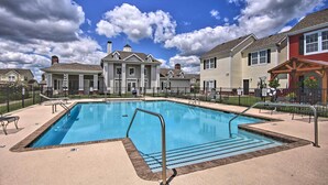 A swimming pool with a metal ladder and steps, surrounded by a fence. - 1 Block to Boat Ramp: Monkey Island Home (Afton)