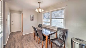 A dining area with a marble table, leather chairs, and a chandelier. - Family-friendly Rockford Home w/ Private Yard! (Rockford)