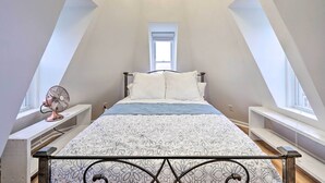 A bedroom with a bed, a fan, and a window. - Brunswick Retreat < 1 Mi to Potomac River! (Brunswick)