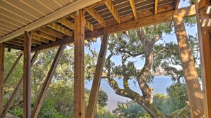 A wooden deck with a view of a lake and trees. - Hillside Home w/ Deck & Views of Tomales Bay! (Inverness)