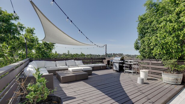 A wooden deck with outdoor seating, a barbecue grill, and potted plants. - San Diego Gem w/ Private Hot Tub, Close to Dtwn! (San Diego)