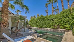 A pool area with lounge chairs, a small table, and a palm tree. - Palm Desert Retreat w/ Private Pool, Near Golf! (Palm Desert)