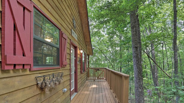A wooden cabin with a deck, surrounded by trees. - Murphy Family Cabin w/ Fire Pit & Forest Views! (Murphy)