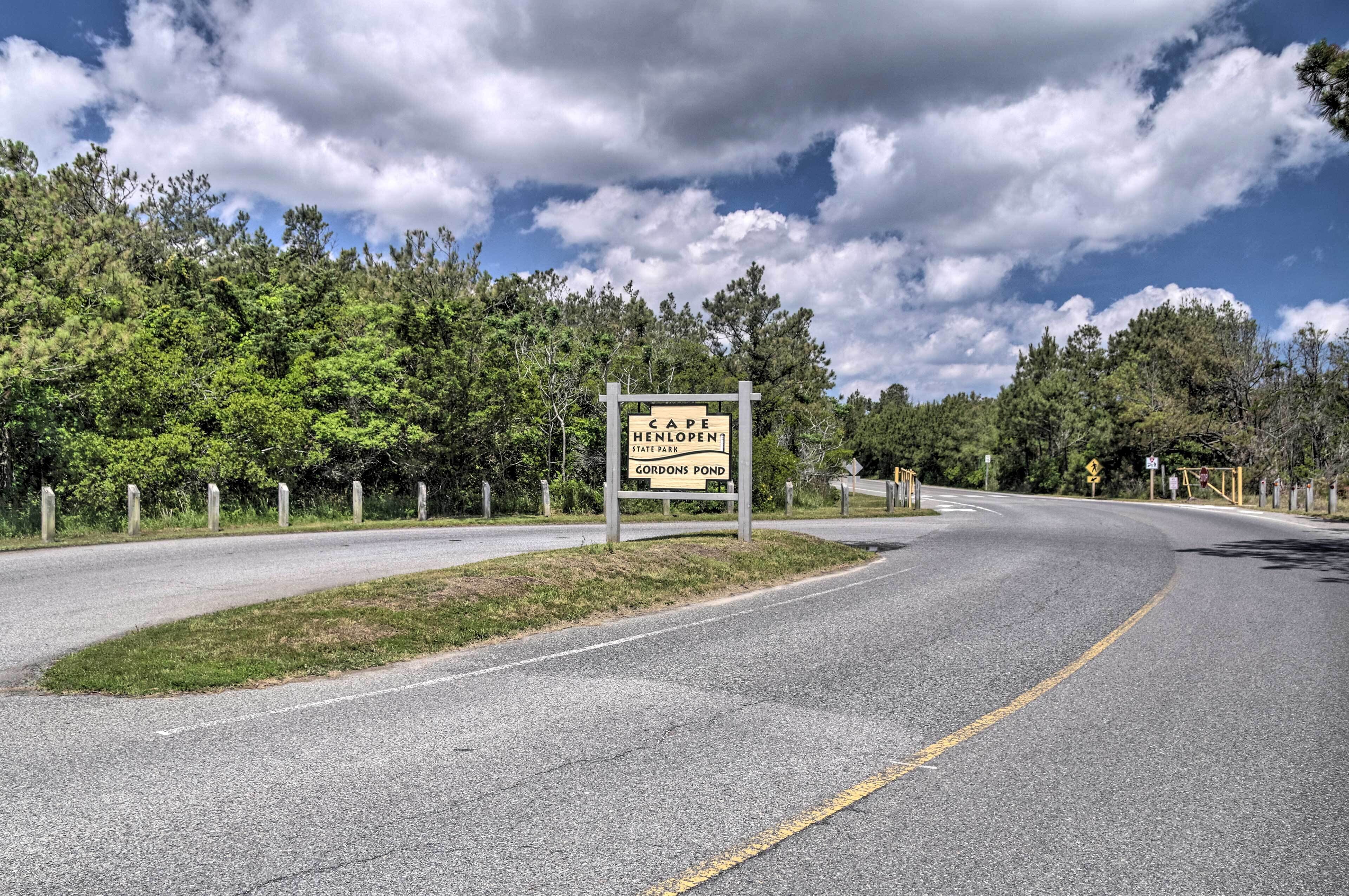 A road sign indicating Cape Henlopen State Park and Gordon's Pond.