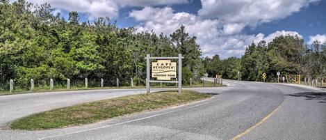 A road sign indicating Cape Henlopen State Park and Gordon's Pond.