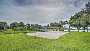 A volleyball court surrounded by lush greenery and trees. - Marco Island Retreat w/ Pool ~ 1 Mi to Beach (Marco Island)