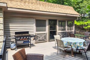 A deck with outdoor furniture, a grill, and a glass door leading to a covered area. - Spacious Mcgaheysville Family Retreat w/ Game Room (McGaheysville)