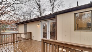 A wooden deck with a railing, a door with glass panels, and a window. - Lovely Massanutten Getaway w/ Resort Access! (McGaheysville)