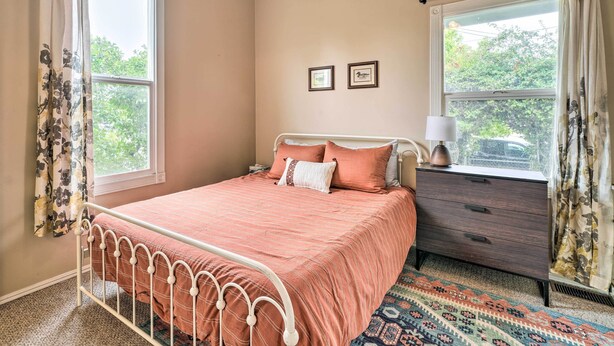 A bedroom with a bed, a dresser, and two framed pictures on the wall. - Charming Santa Paula Home - Walk to Downtown! (Santa Paula)