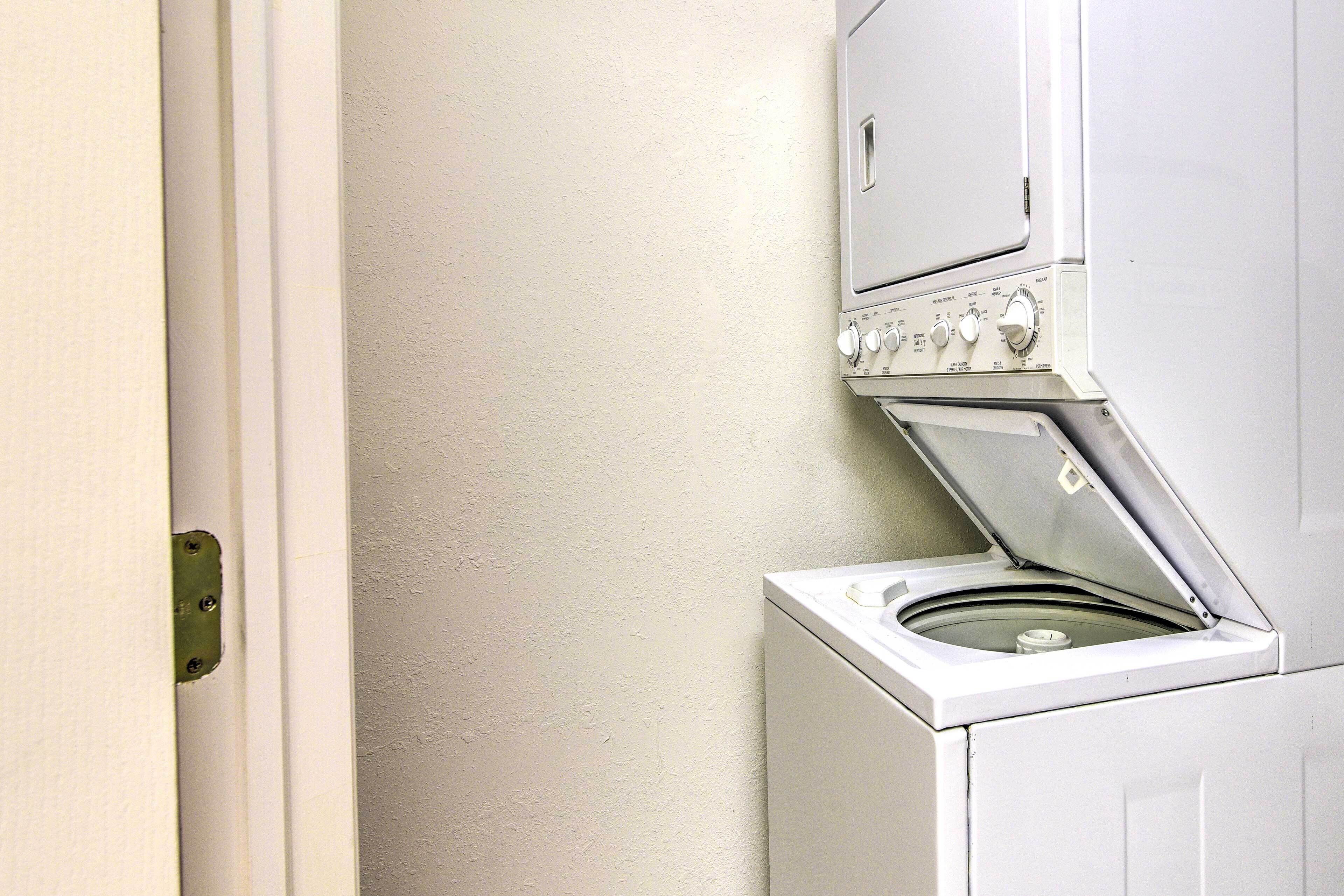 A white washing machine with a control panel and a door.