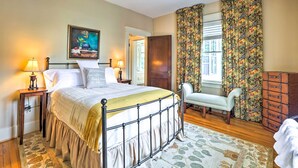 A bedroom with a bed, bedside tables, a chair, a dresser, and a ceiling fan. - Lovely Apt, 1 Block to Downtown Danville (Danville)