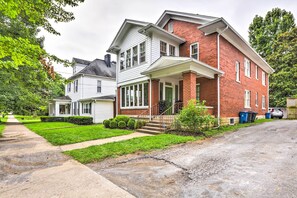 A two-story house with a front porch, a garage, and a driveway. - Lovely Apt, 1 Block to Downtown Danville (Danville)