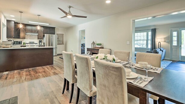 A modern kitchen with dark cabinets, stainless steel appliances, and pendant lighting. - Waterfront Retreat < 4 Mi to Dtwn Cambridge! (Cambridge)