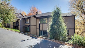 A modern building with a flat roof, large windows, and a visible garage door. - 1/2 Mi to Sugar Mtn Resort: Condo w/ Balcony (Banner Elk)