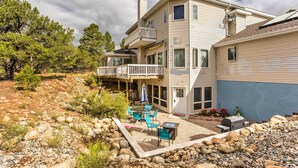 A two-story house with a balcony, outdoor seating area, and a grill. - Cozy Buena Vista Apartment < 4 Mi to Main Street! (Buena Vista)