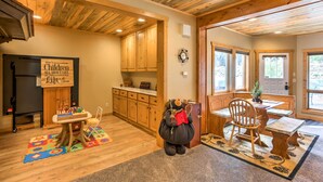 A cozy room with wooden ceilings, a kitchen area, and a dining space with a table and chairs. - Cozy Buena Vista Apartment < 4 Mi to Main Street! (Buena Vista)