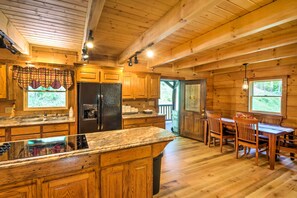 Enjoy meals in the kitchen with a dishwasher and dining area with a table and chairs.