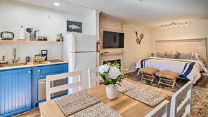 A compact living space with a kitchen, dining area, and bedroom. - Balcony + Pool Access! Couples Escape in Lake Lure (Lake Lure)