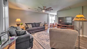 A living room with a sofa, armchairs, a TV, and a ceiling fan. - Deep Gap Cottage w/ Fire Pits - Hike & Ski! (Deep Gap)