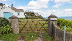 A gated entrance to a coastal property with a sign reading "BEACHCLIFF". - Beachcliff (St Austell)