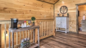 A wooden interior with a coffee station, a cabinet, and a decorative wall piece. - Hot Tub, Game Room, Decks: Cabin in Gatlinburg (Gatlinburg)