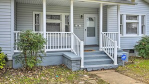 A two-story house with a front porch, a small front yard, and a mailbox. - Inviting Home, 1 Mi to High Point University! (High Point)
