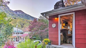 A red building with a sign reading "Welcome in some." - Mtn Views + Fire Pit: Serene Chimney Rock Abode (Chimney Rock)