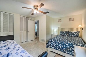 Cozy retreat with a comfortable bed, bedside table, and wardrobe.