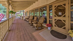 A covered porch with wooden flooring and seating. - House of Angels Retreat w/ Deck Near Winter Park (Ruidoso)